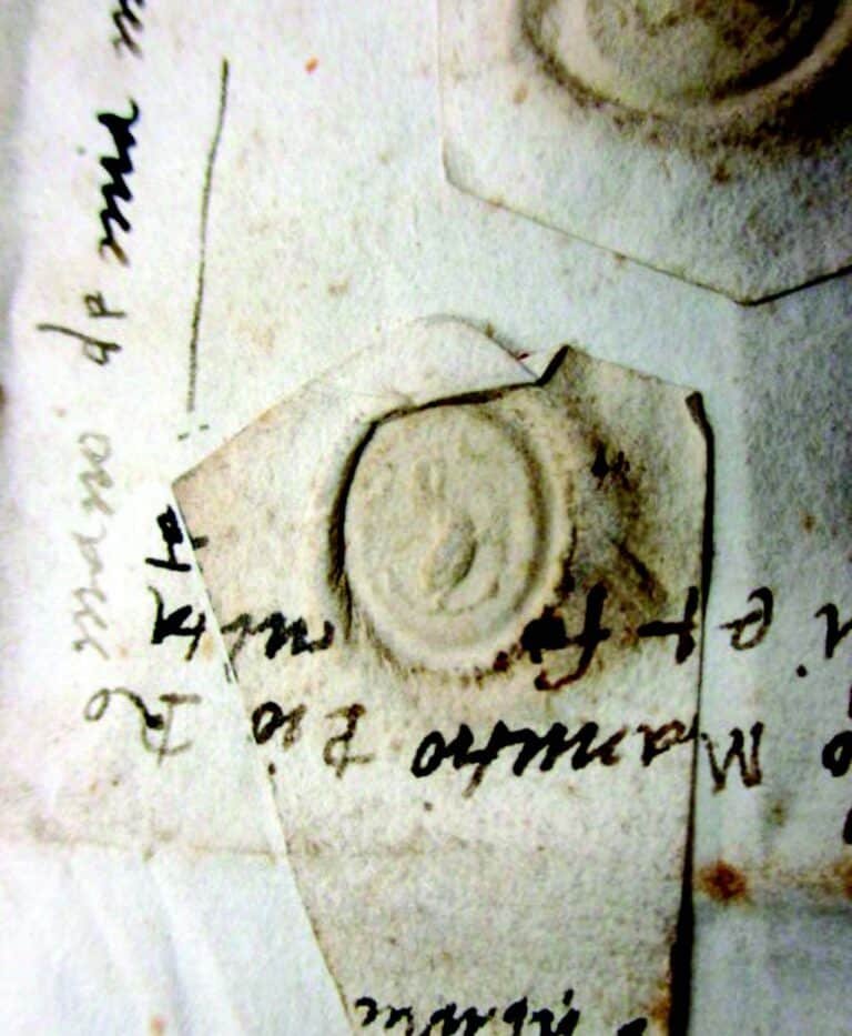 Aldo Manuzio, Sigillo nella cedola testamentaria autografa del 27 marzo 1506 attorniato dalla sua scrittura, in Venezia, Archivio di Stato, Notarile, Testamenti, b.765.2